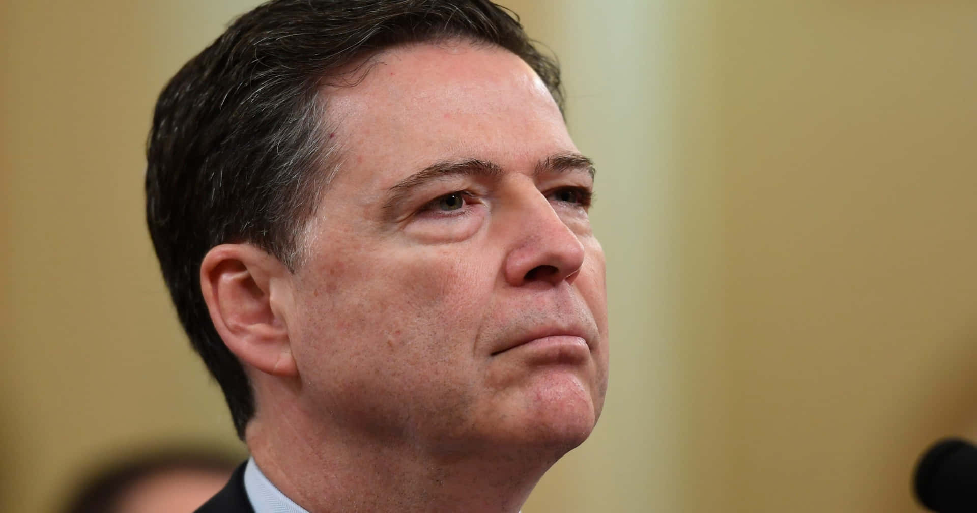 Download James Comey Serious Expression Wallpaper | Wallpapers.com