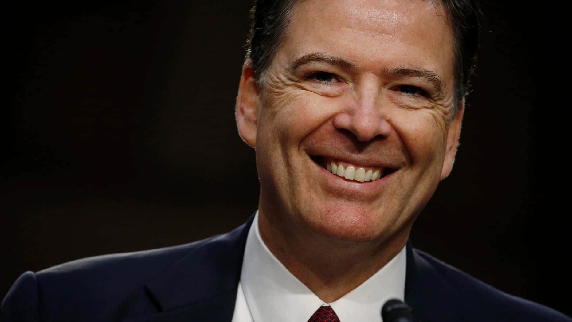 James Comey Smiling During Event Wallpaper