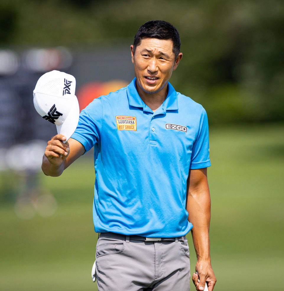 Golf Pro, James Hahn Holding White Cap Wallpaper