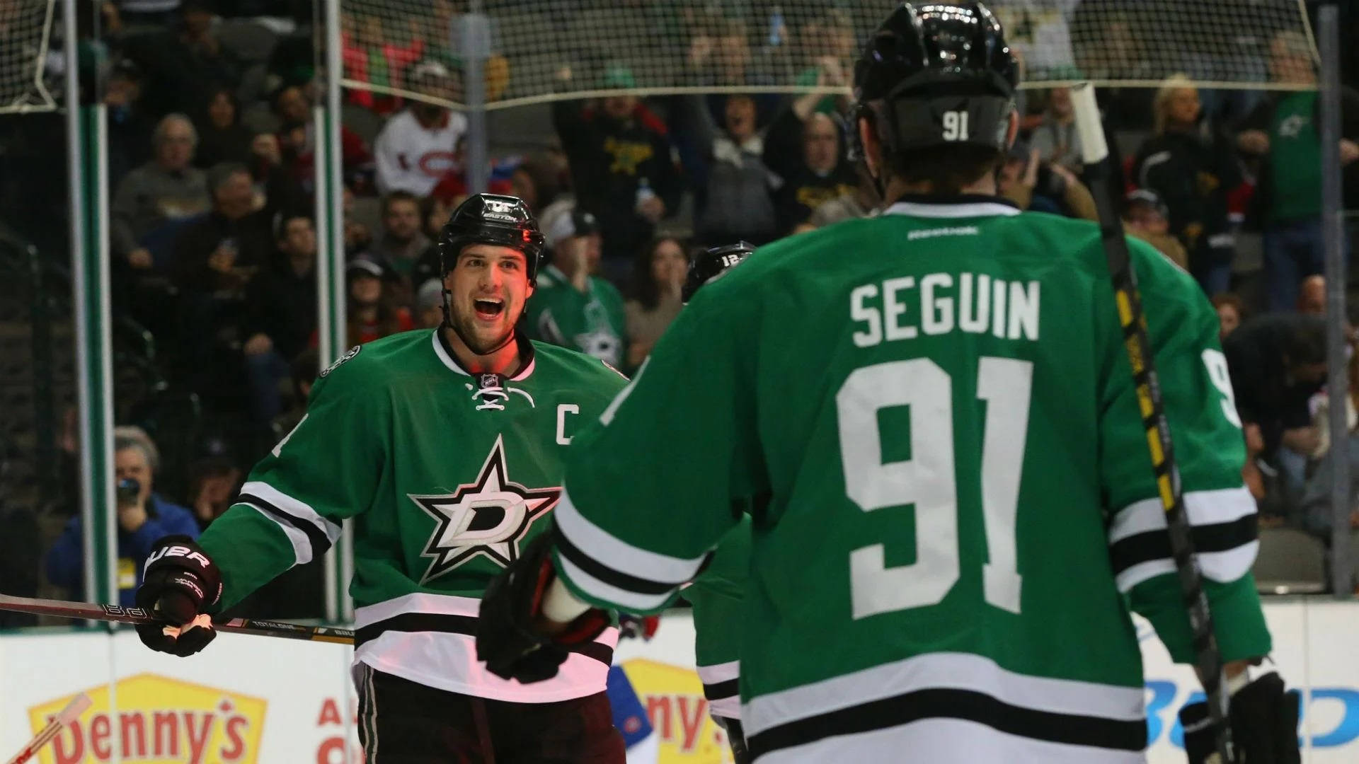 Excited Jamie Benn with Tyler Seguin after an Important Match Wallpaper
