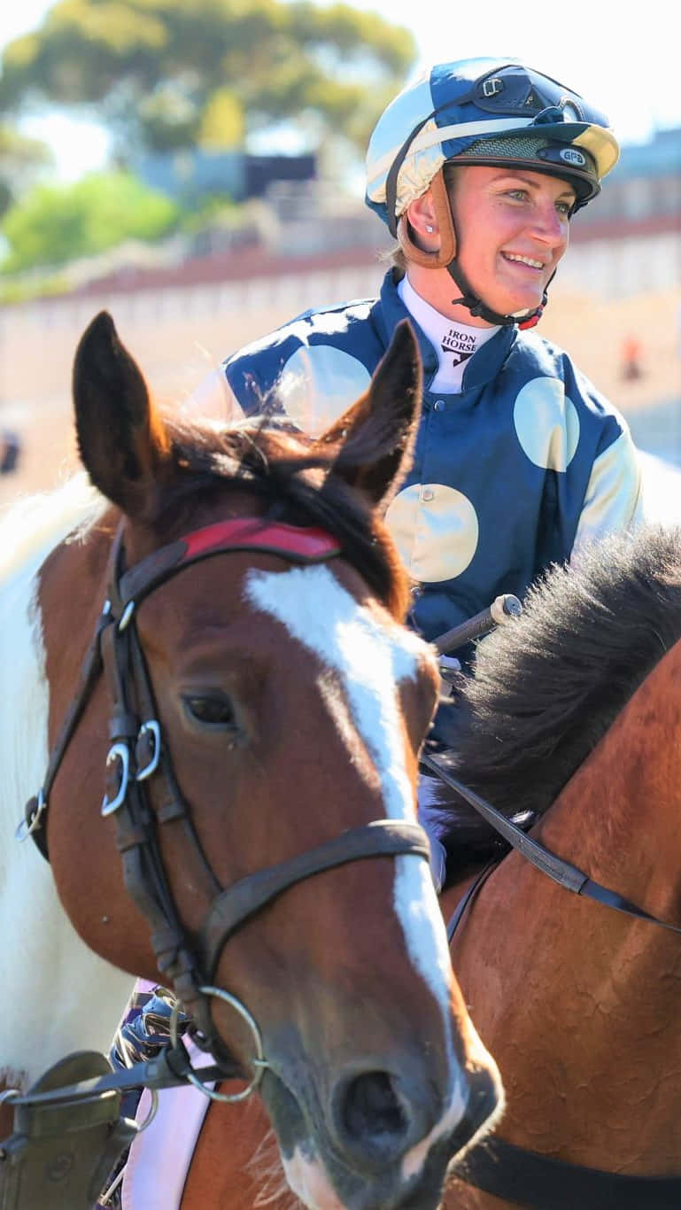 Jockey Jamie Kah in action on horseback Wallpaper