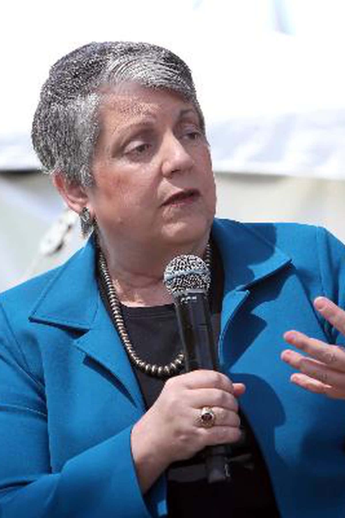 Janet Napolitano Holding Microphone Wallpaper