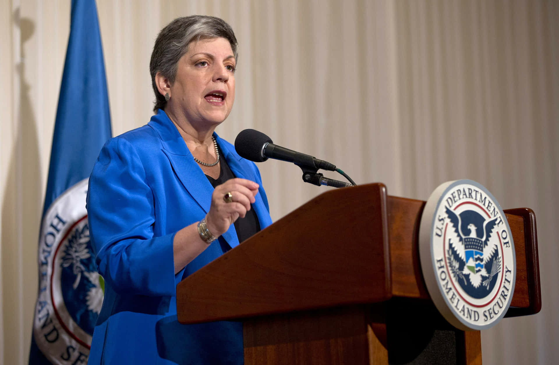 Janet Napolitano Speaking And Gesturing Wallpaper