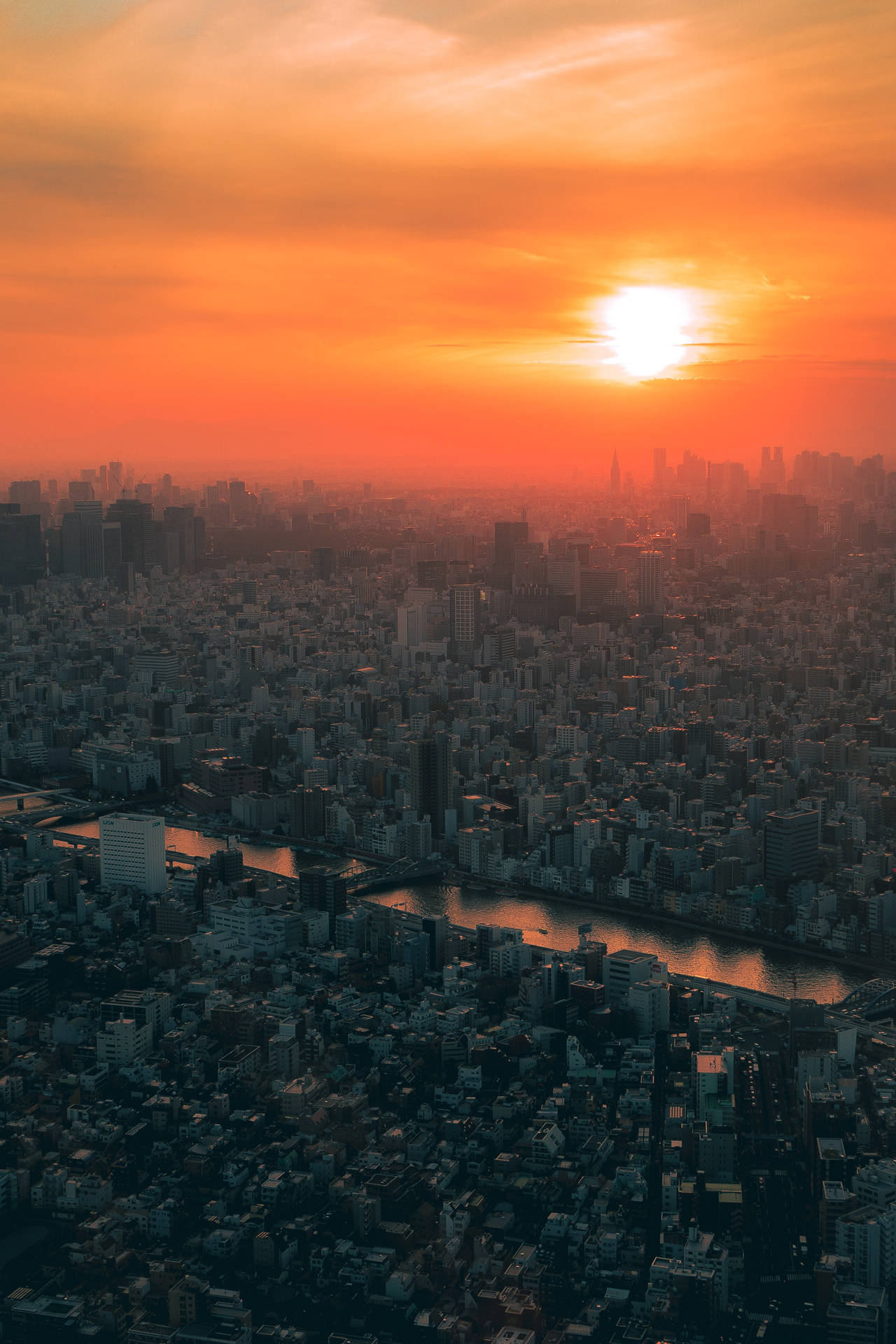 Breathtaking View of Japan's Cityscape at Sunset Wallpaper