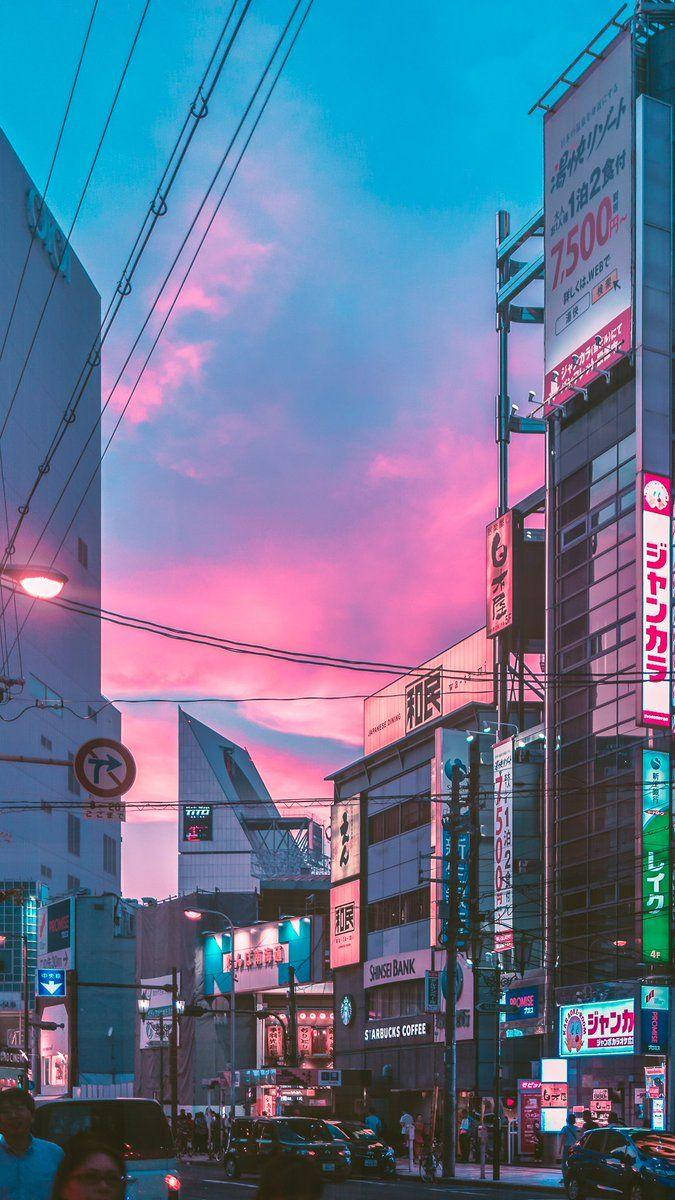 Japanese Aesthetic Iphone Purple Clouds Above Buildings Wallpaper