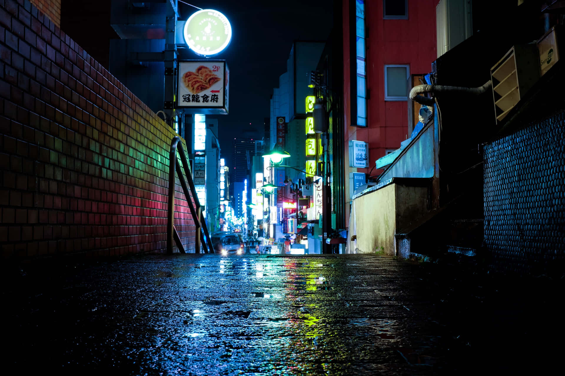 A brilliant nightscape of Kyōto, Japan dominated by red neon signage Wallpaper