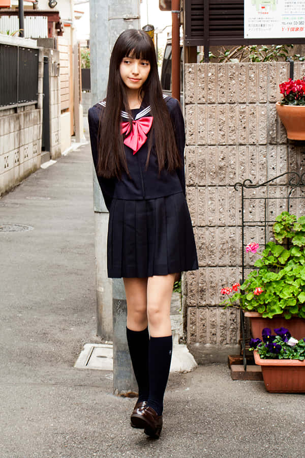 Japanese School Girl In Alley Wallpaper