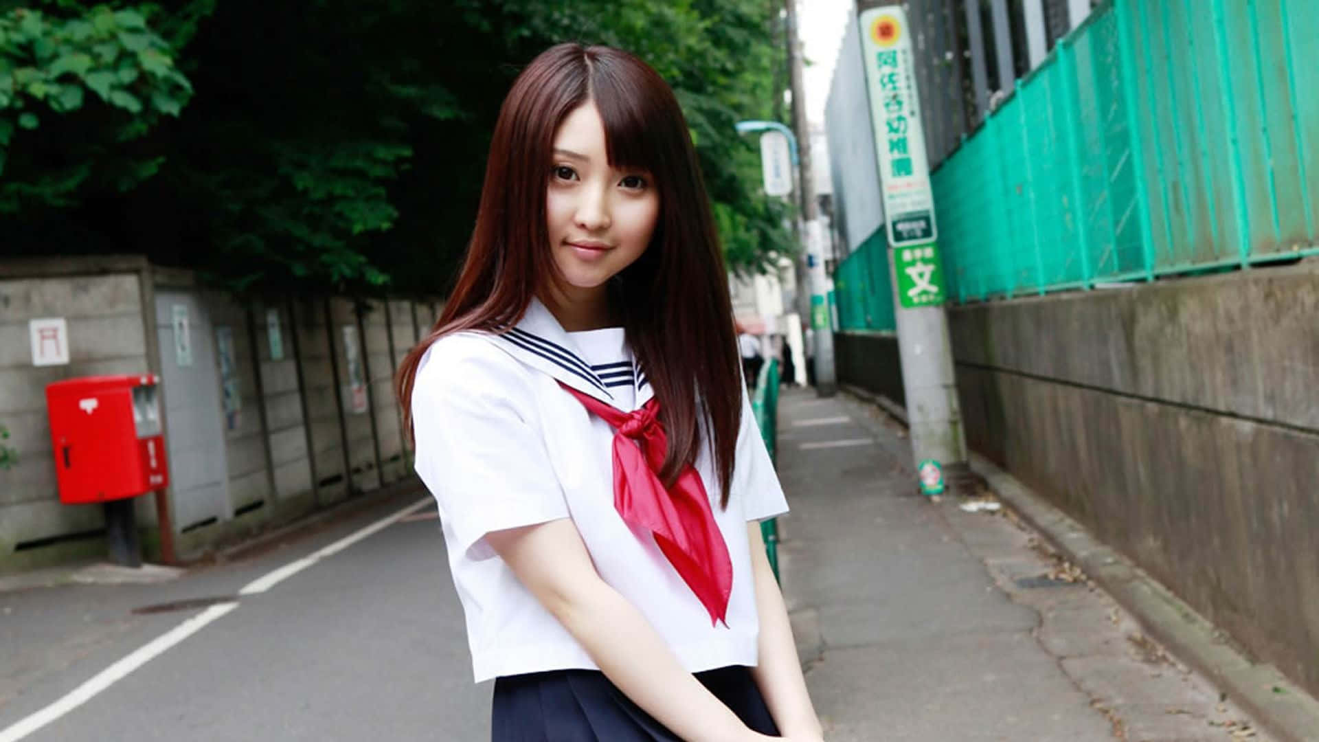 Japanese School Girl Poses Wallpaper
