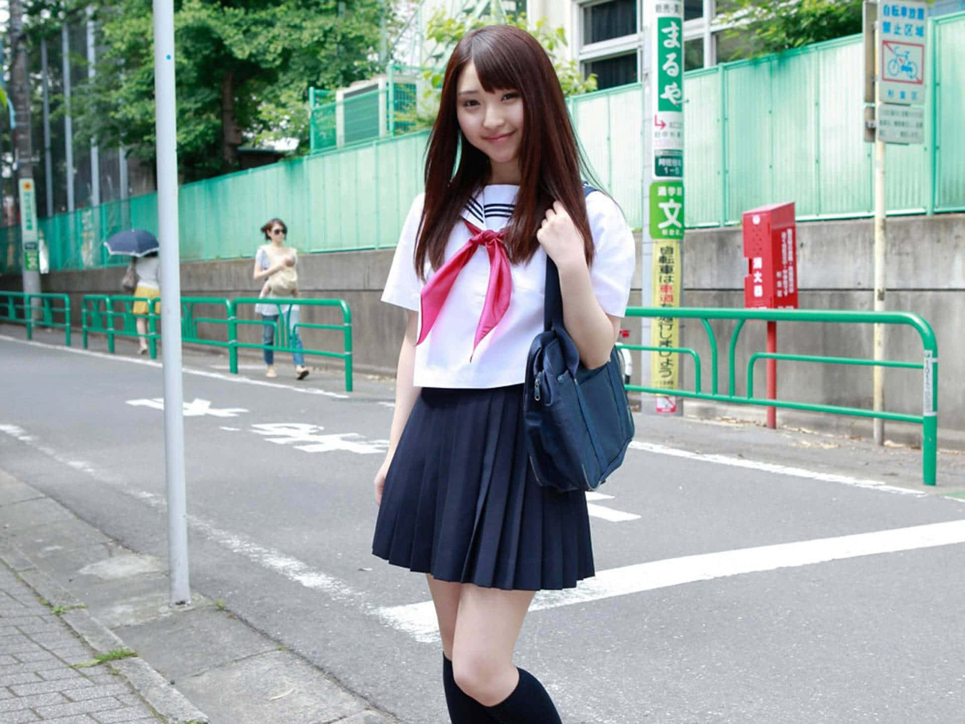 Japanese School Girl Poses Wallpaper