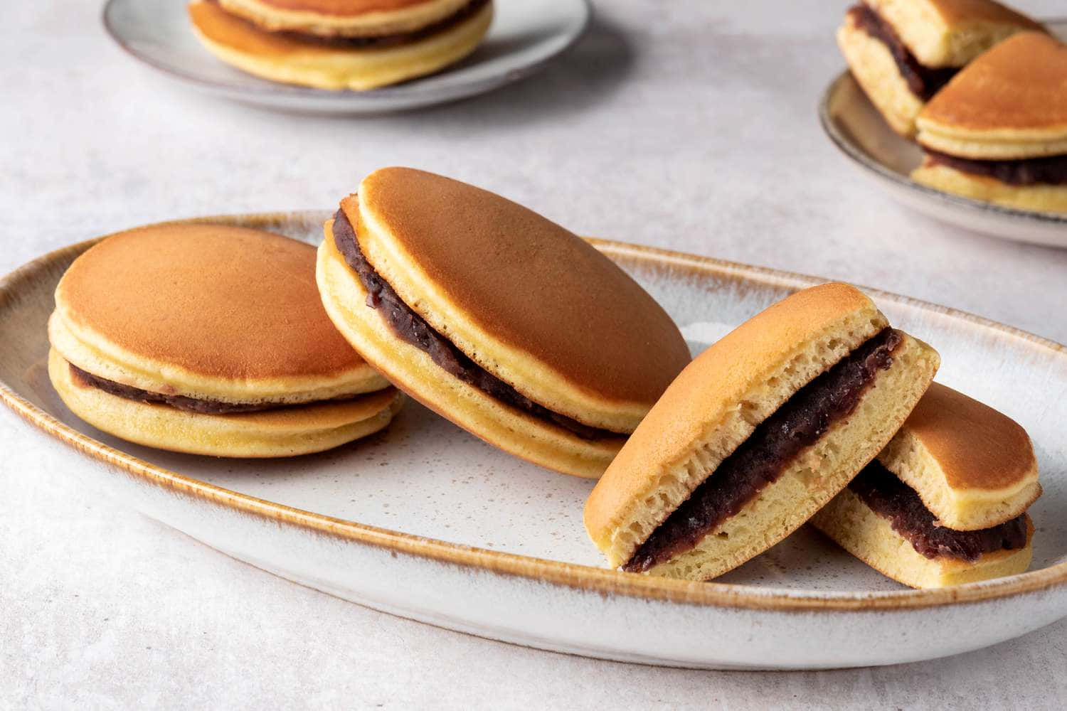 Caption: Traditional Japanese Sweets on a Plate Wallpaper