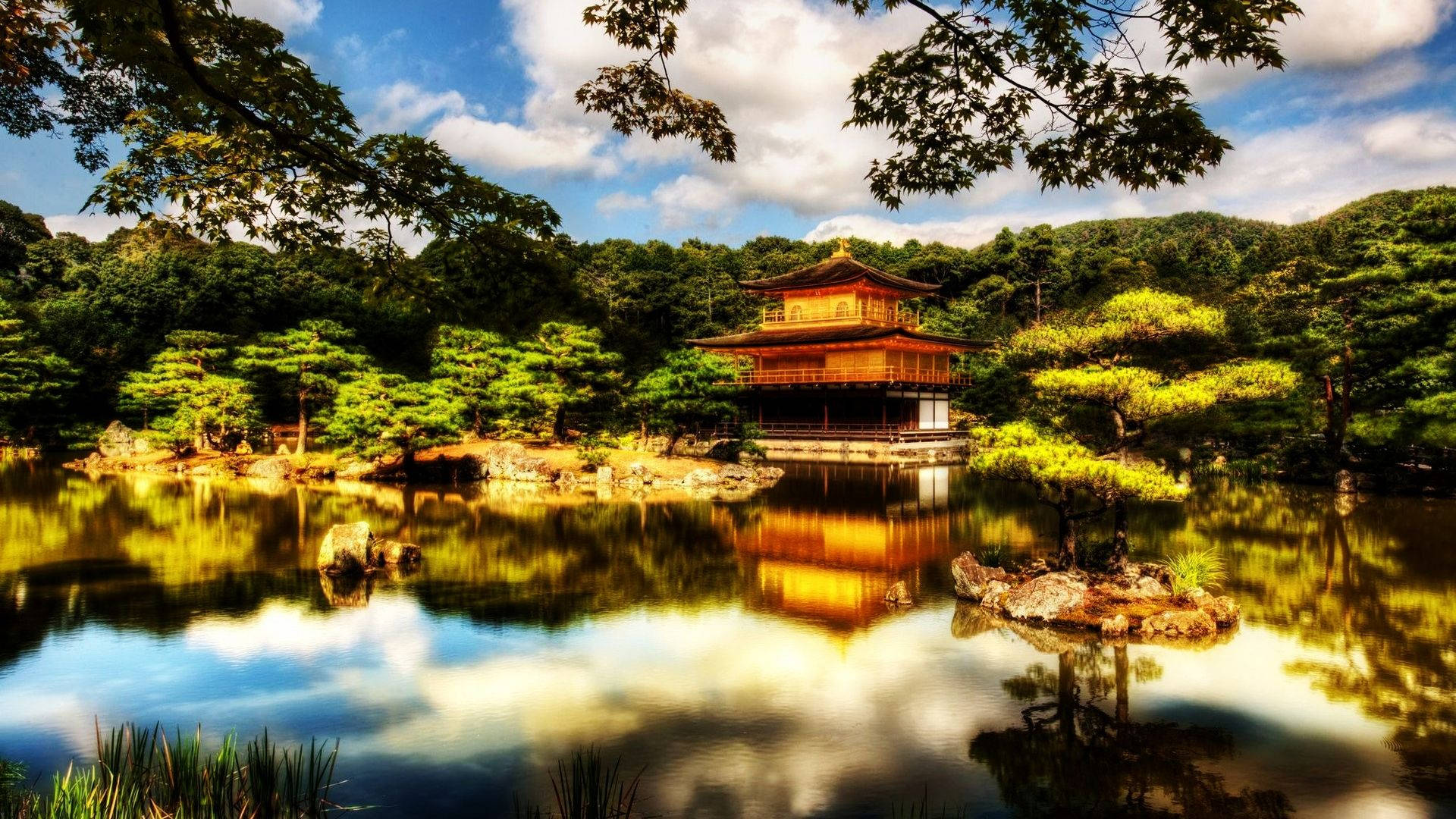 Japanese temple beautifully reflected in the clear pond Wallpaper
