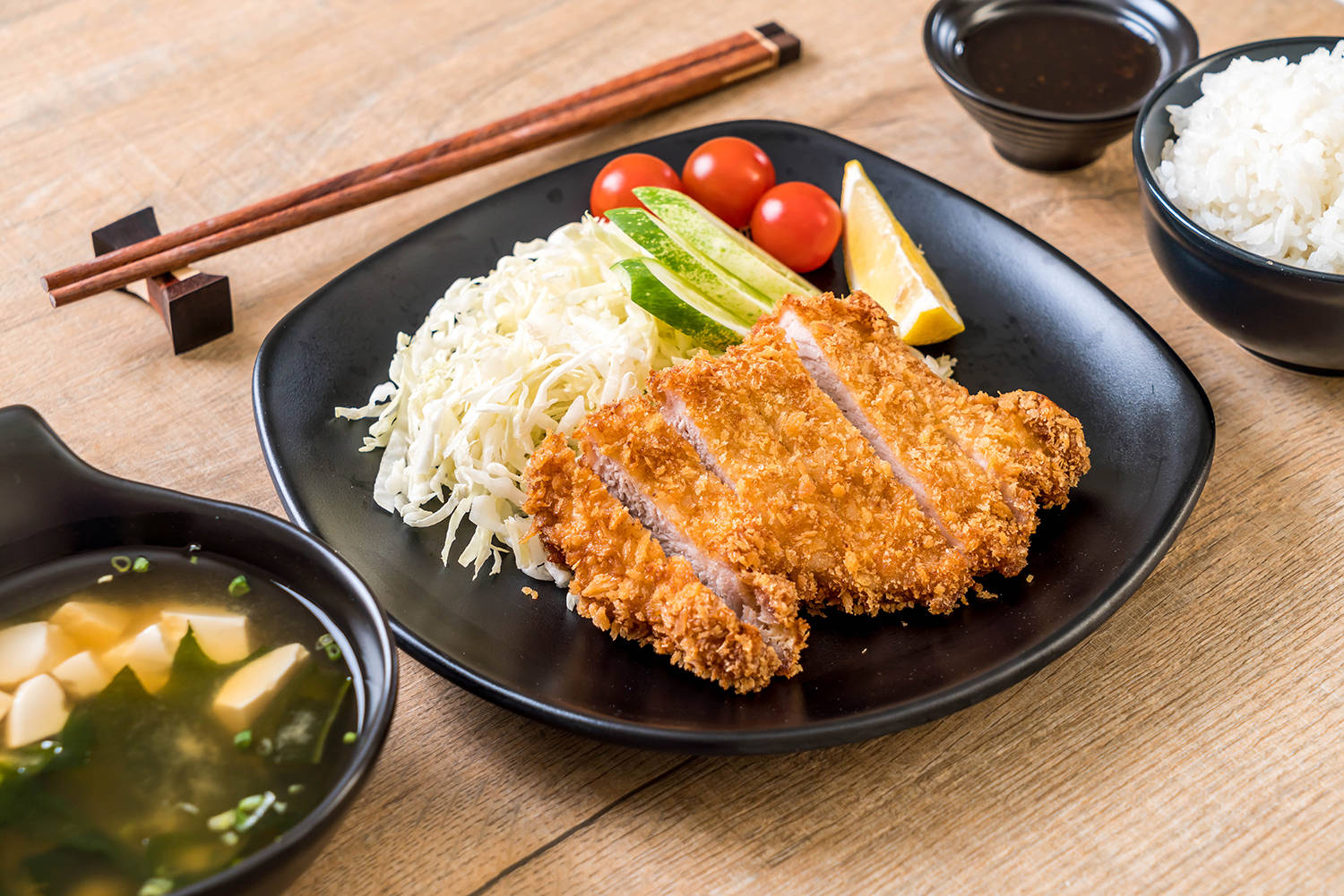 Japanese Tonkatsu Served With Other Dishes Wallpaper