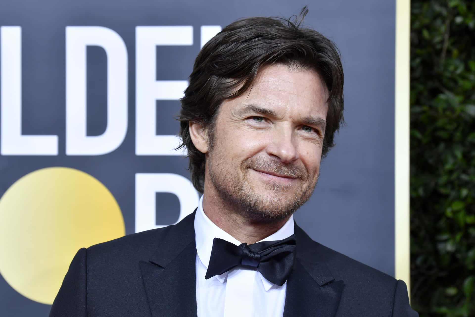 Jason Bateman Exudes Charm and Sophistication Wallpaper