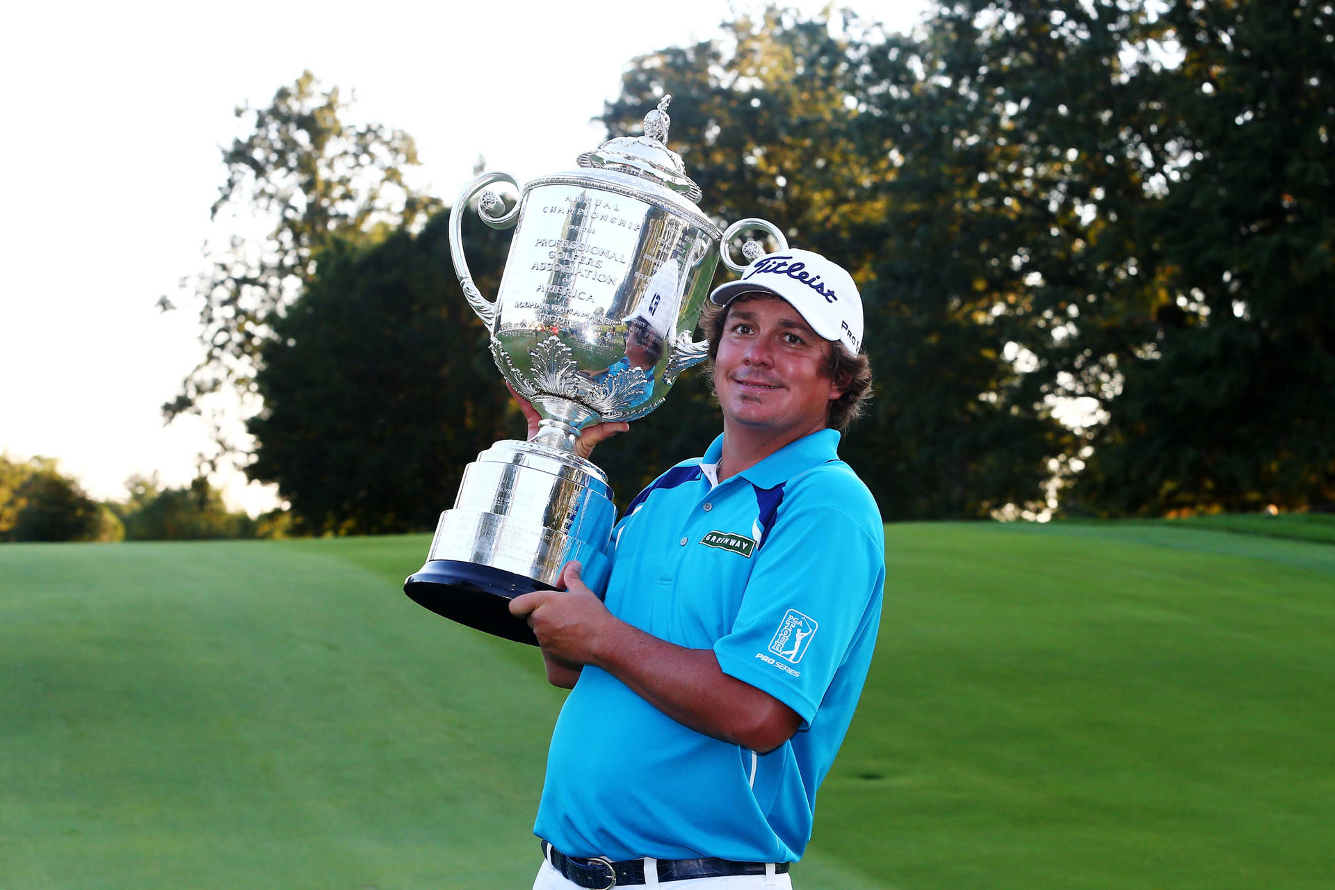 Jason Dufner Carrying His Silver Trophy Wallpaper