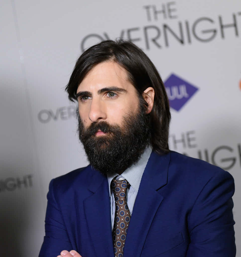 Actor Jason Schwartzman poses for a photo on the red carpet Wallpaper