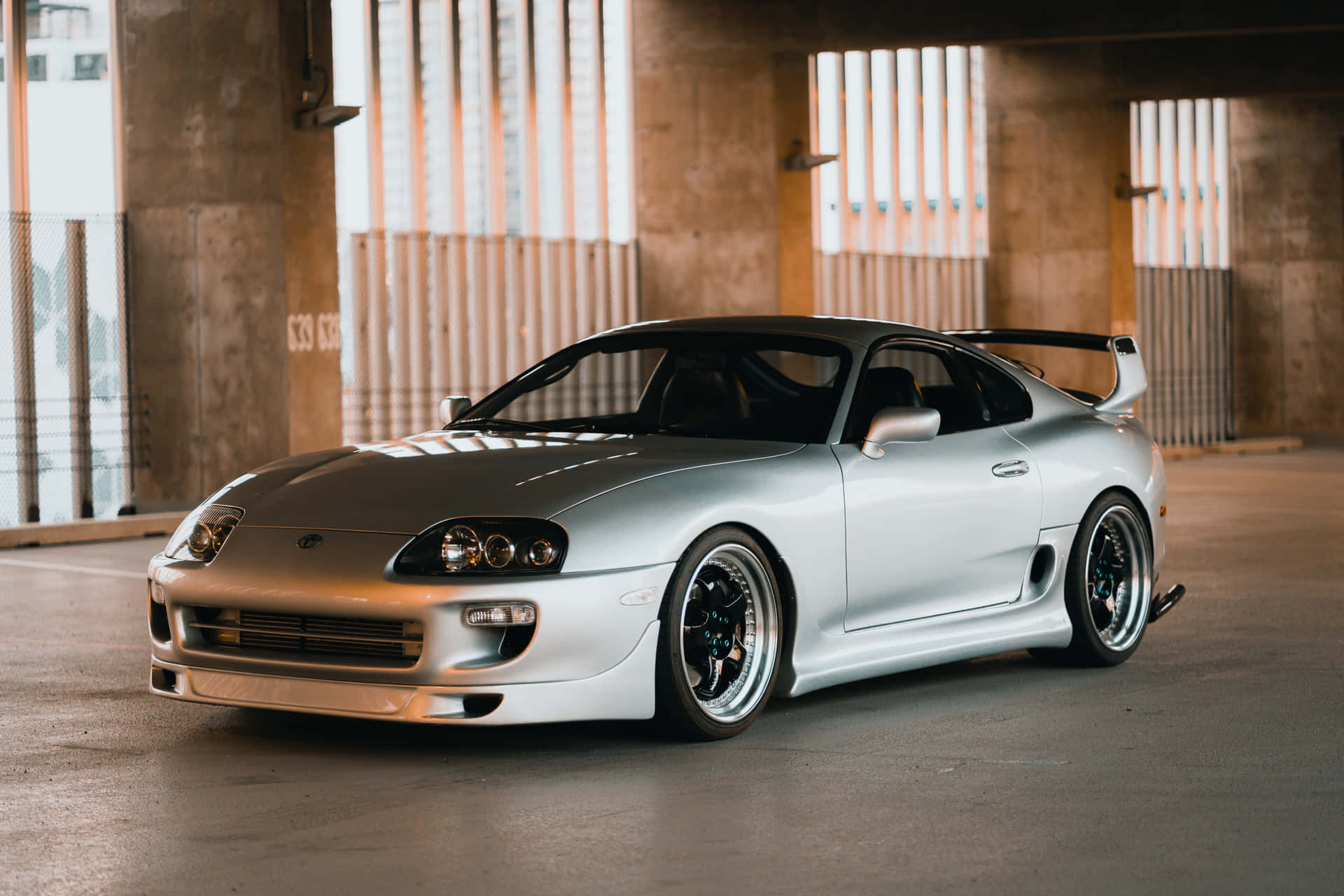 Zoom Past in Style with a Toyota Supra Wallpaper