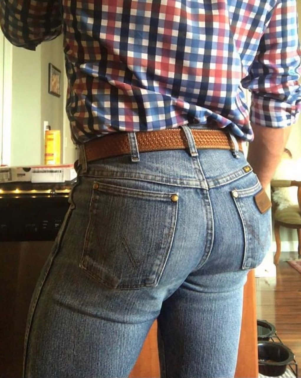 Denim jeans on a vintage wooden background