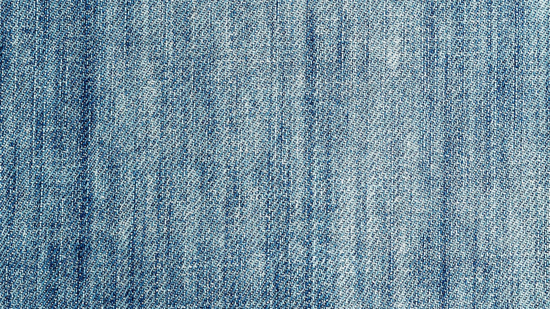 A Close Up Of A Blue Denim Fabric