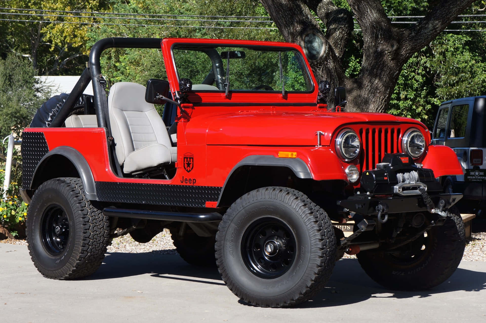 Caption: Classic Jeep CJ on a picturesque off-road adventure Wallpaper