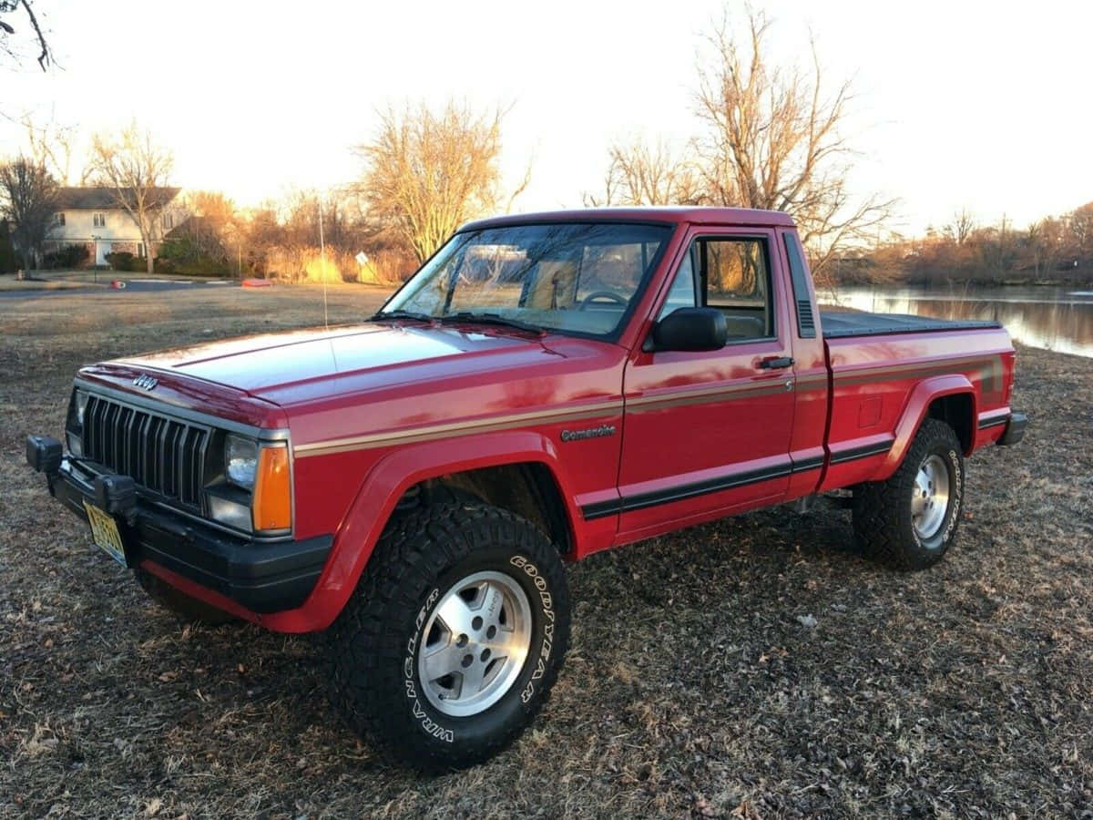 Majesteettinen Jeep Comanche Kulkee Vaikeassa Maastossa Suurilla Ulkoalueilla Taustakuva