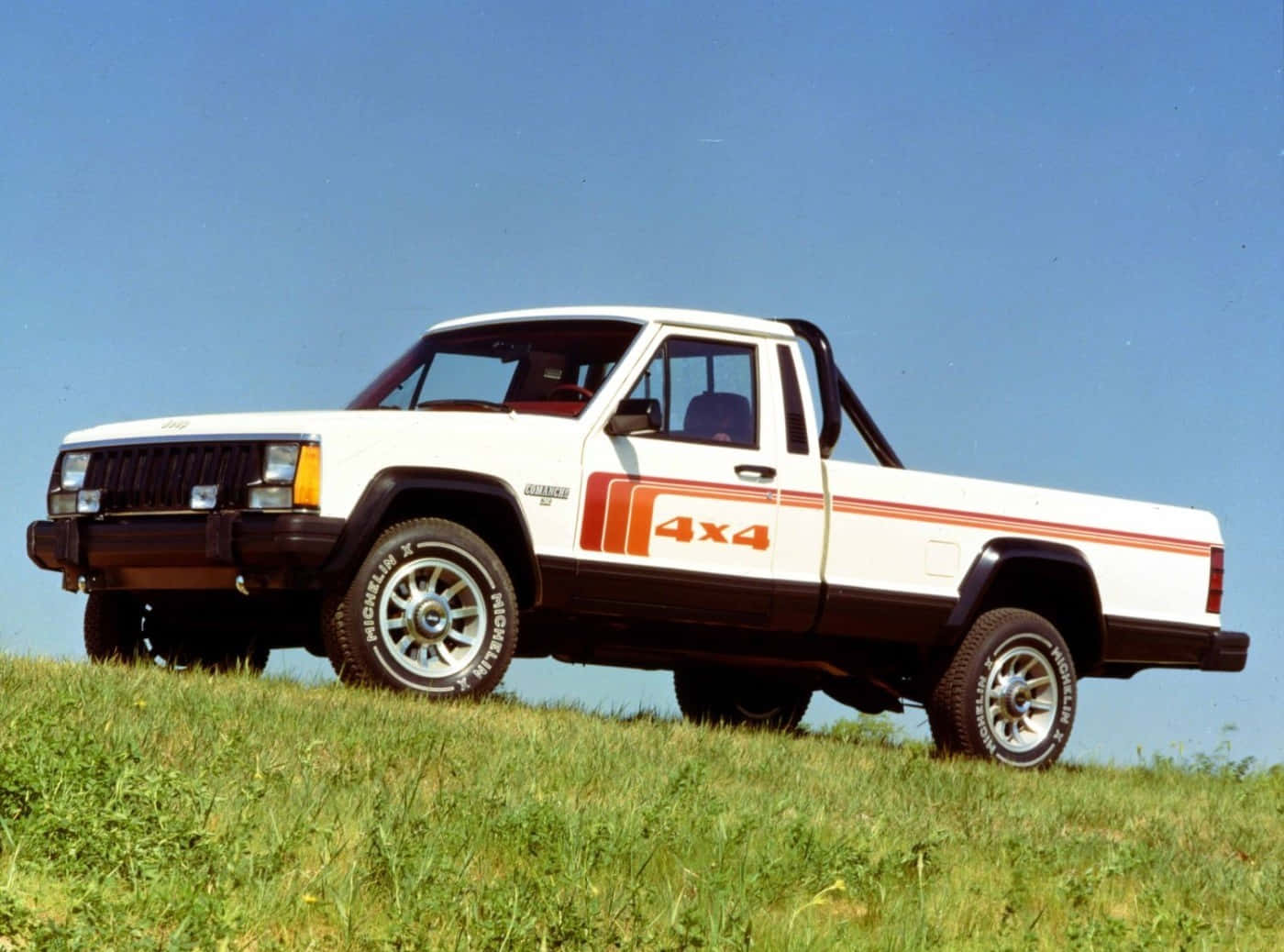 Vintage Jeep Comanche on an Off-Road Adventure Wallpaper