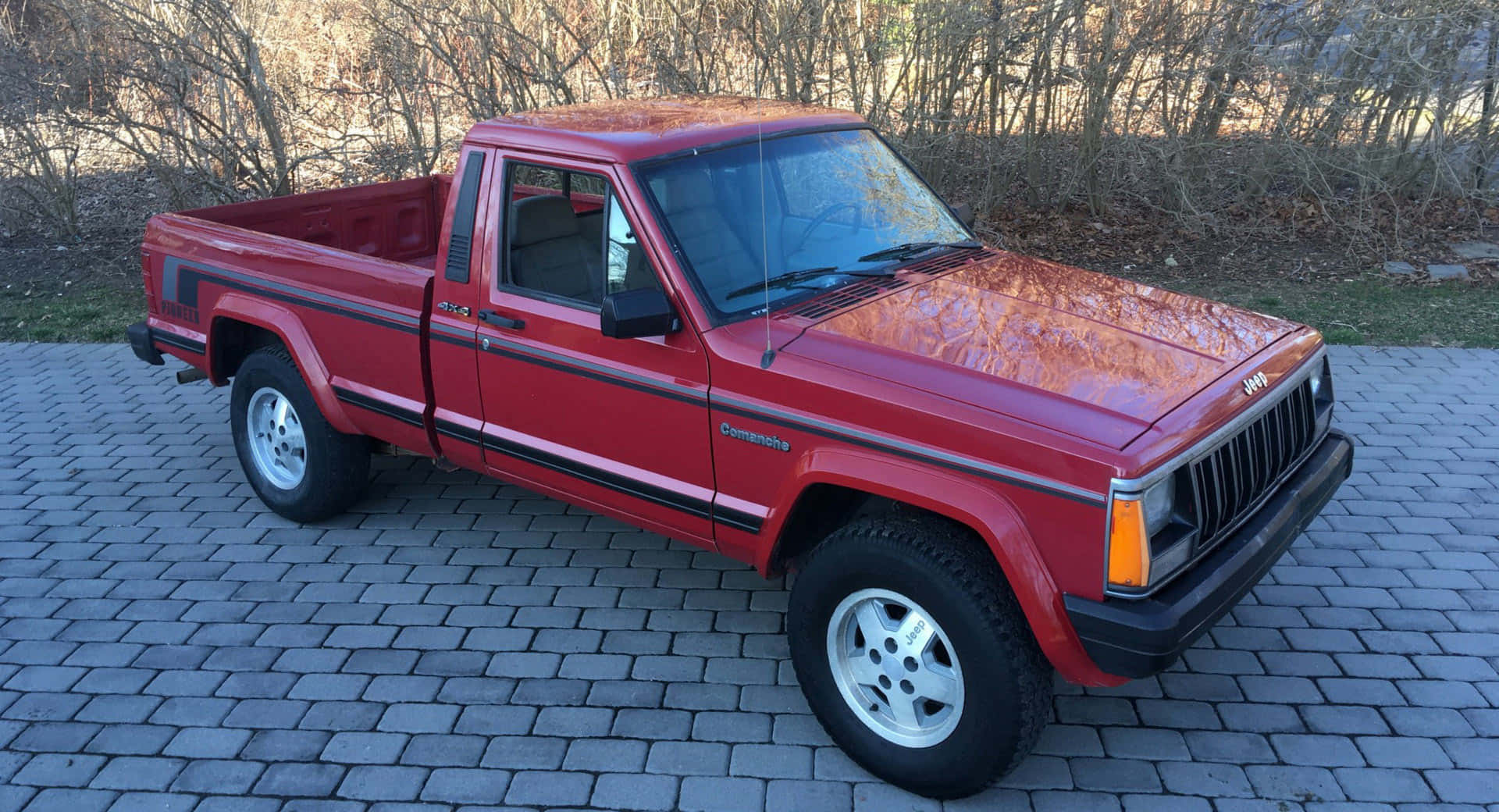 Stunning Jeep Comanche off-roading in the wilderness Wallpaper