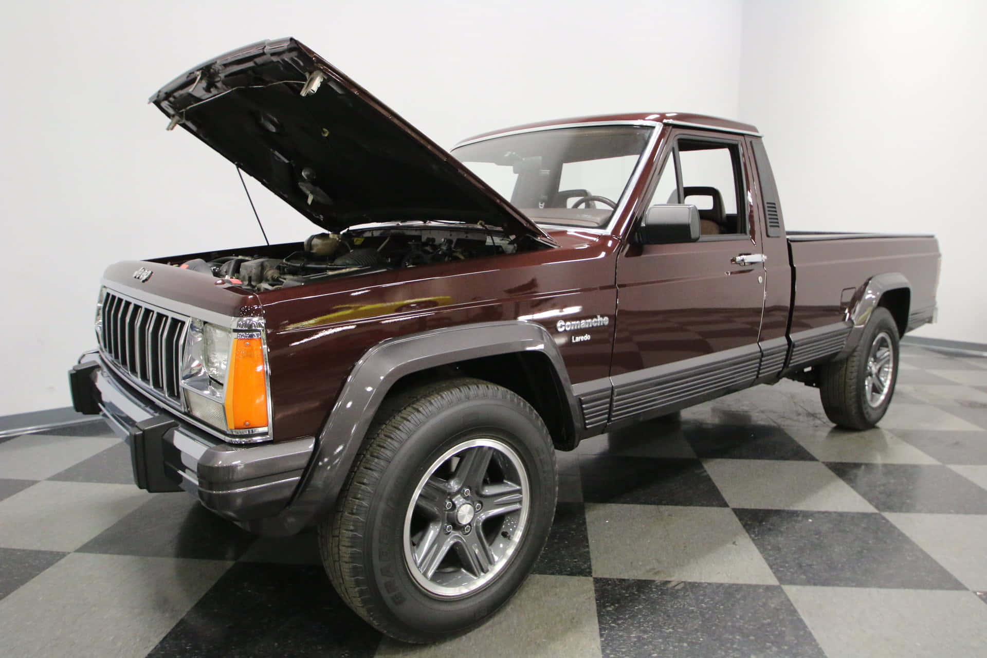 Classic Jeep Comanche conquering rugged terrain Wallpaper