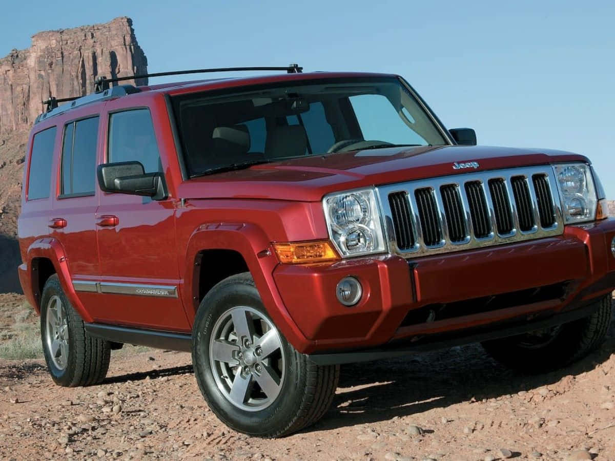 Jeep Commander Éblouissante Aventure À Travers Un Terrain Rugueux Fond d'écran