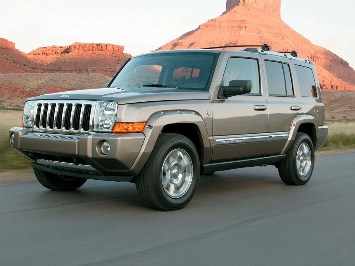 Rugged Jeep Commander conquering off-road terrain Wallpaper