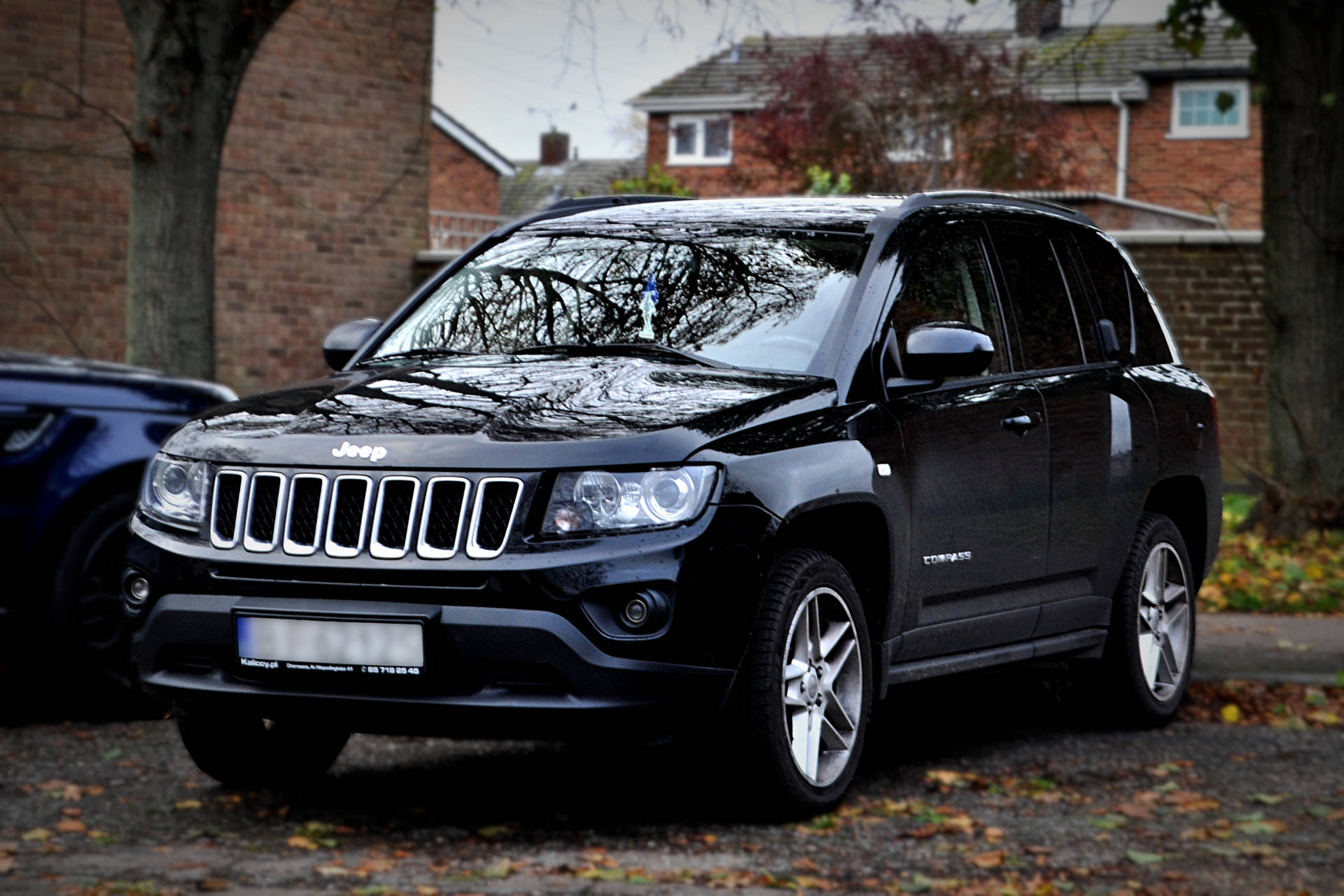 Jeep Compass Black Aesthetic With Leaves Under Wallpaper