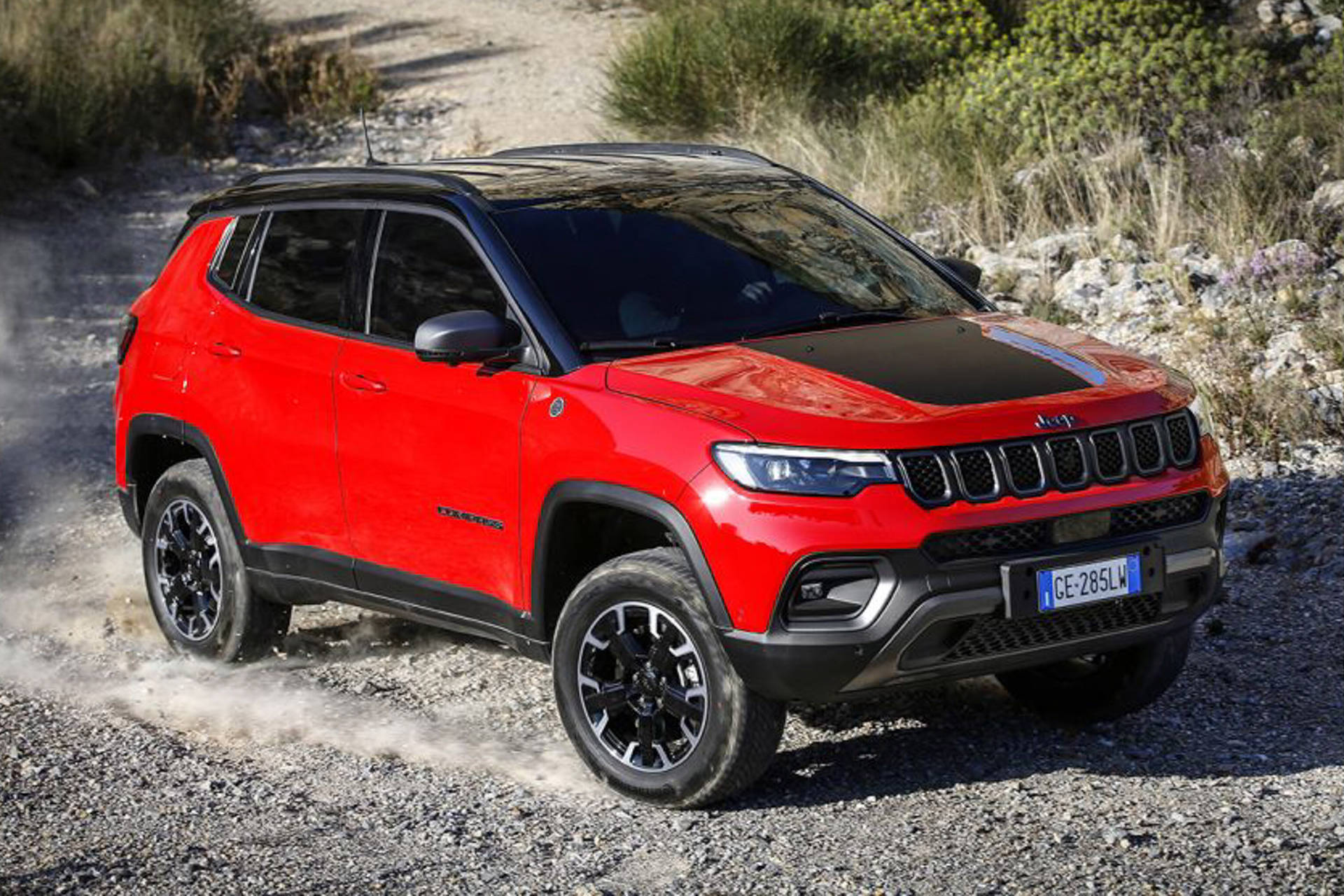 Majestic Black and Red Jeep Compass Dominating the Gravel Road Wallpaper