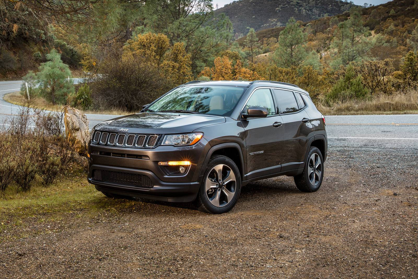 Jeep Compass On Dirt With Plants Wallpaper