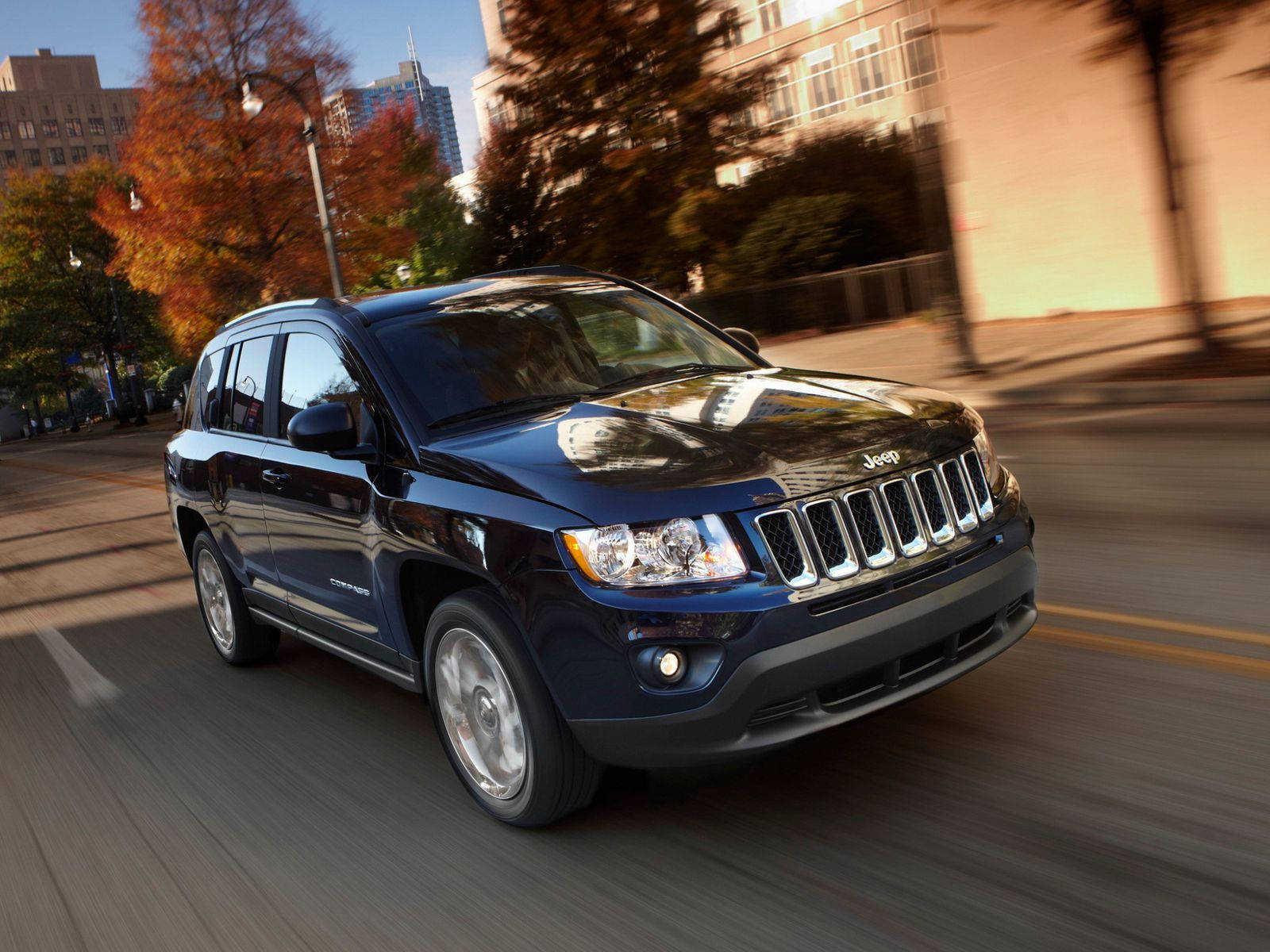 Jeep Compass Zooming On Road Wallpaper