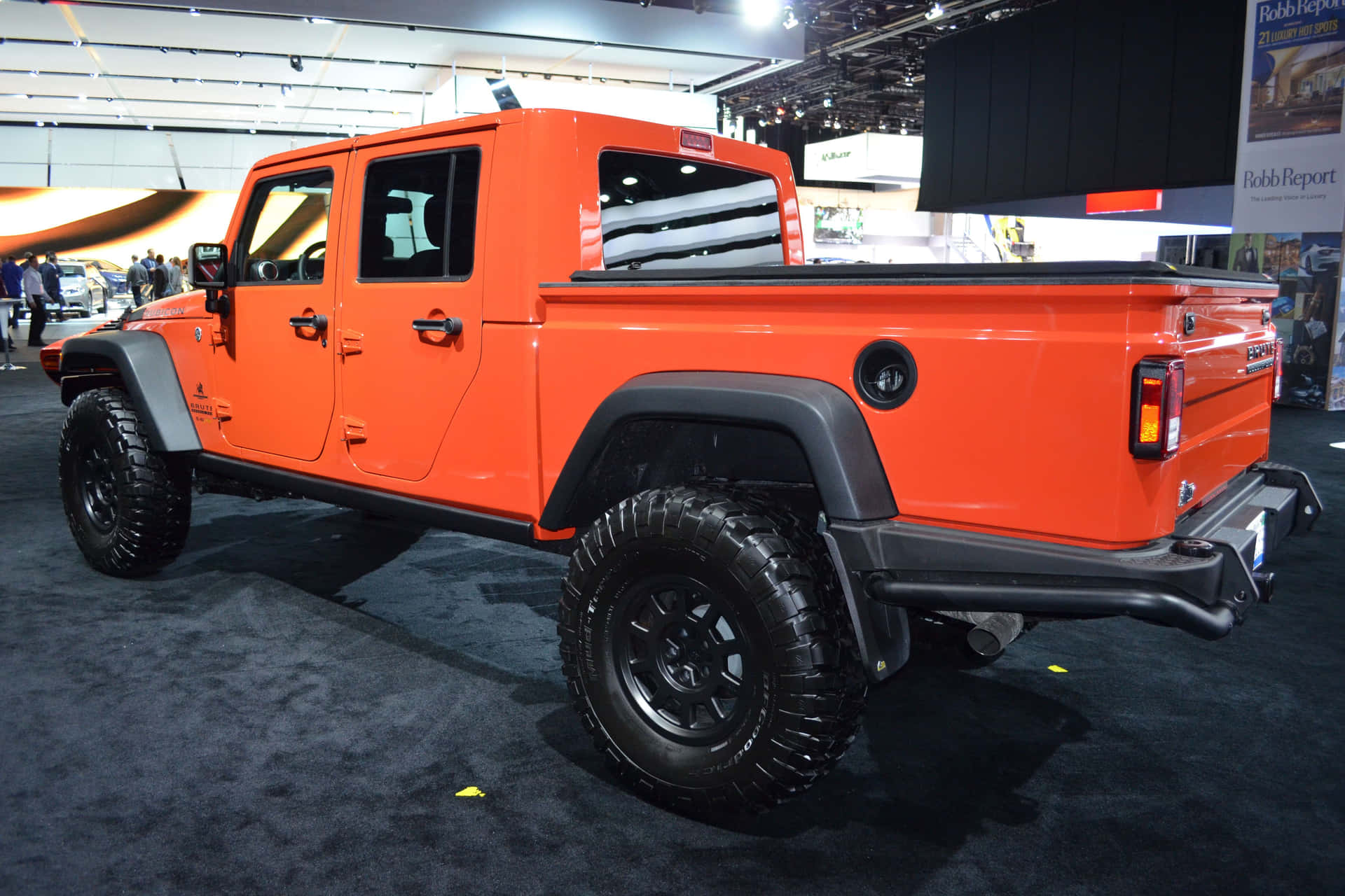 Impresionantejeep Gladiator Conquistando El Terreno Al Aire Libre. Fondo de pantalla