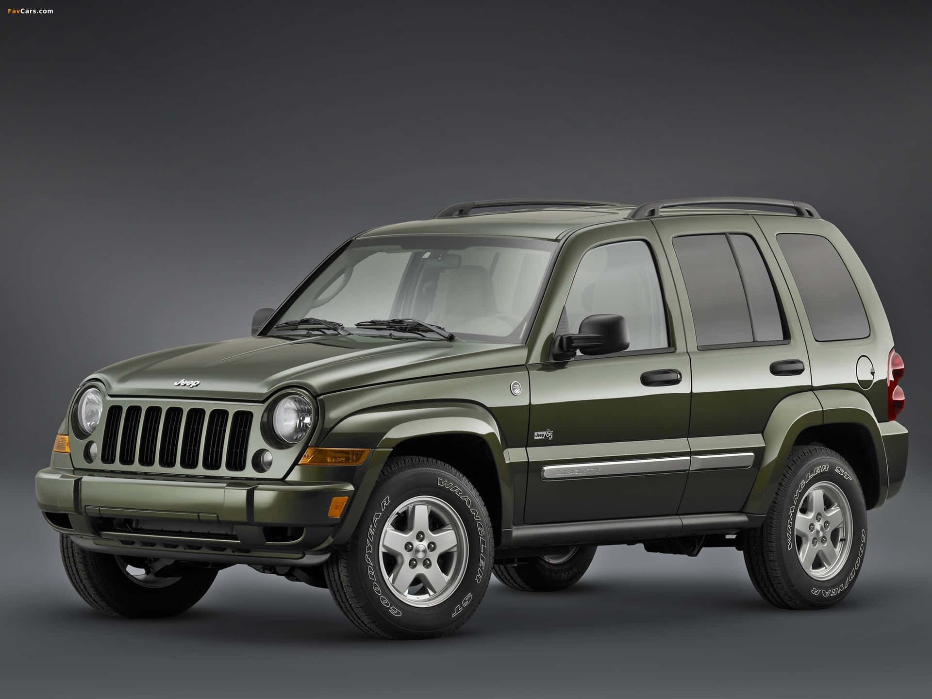 Impresionantejeep Liberty En Un Sendero De Montaña Pintoresco. Fondo de pantalla