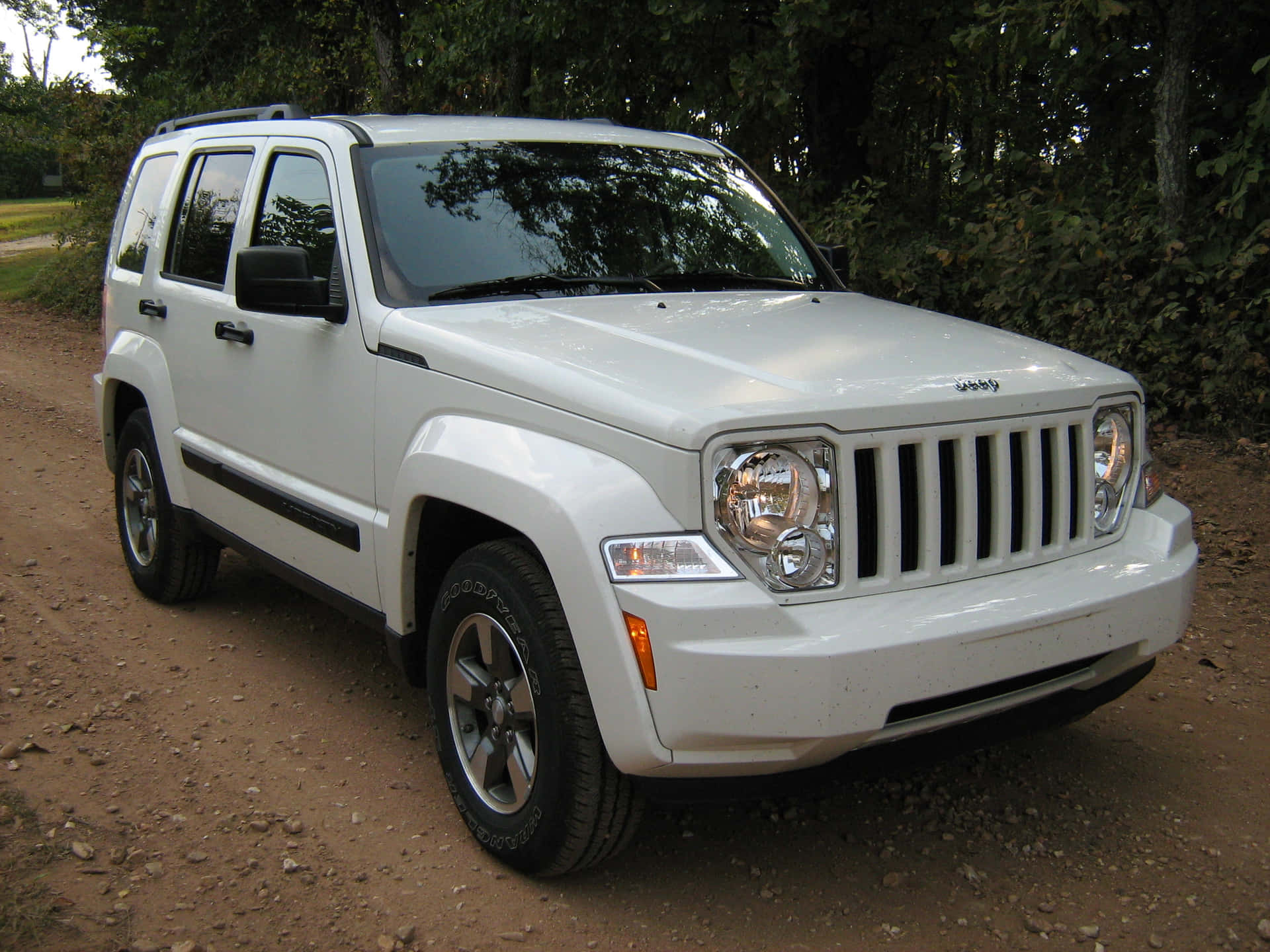 Rugged Jeep Liberty SUV on Adventure-filled Terrain Wallpaper