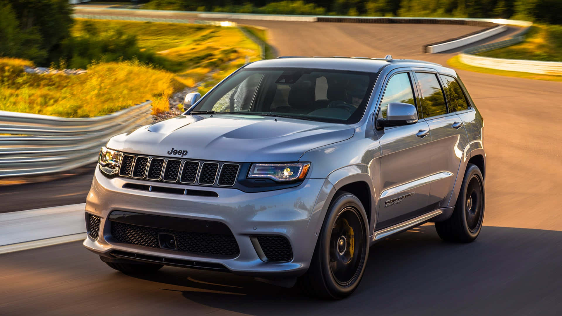 The 2019 Jeep Grand Cherokee Is Driving On A Curve Wallpaper