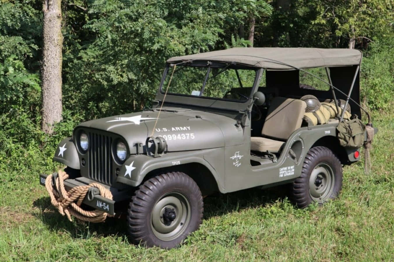 Vintage Jeep Willys on a Serene Beach Wallpaper