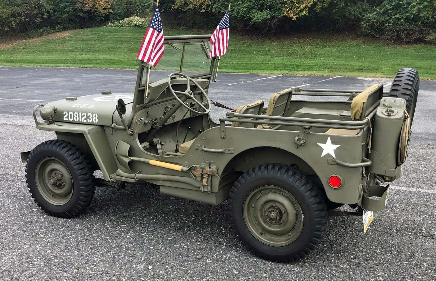 Caption: Classic Jeep Willys in the Wild Wallpaper