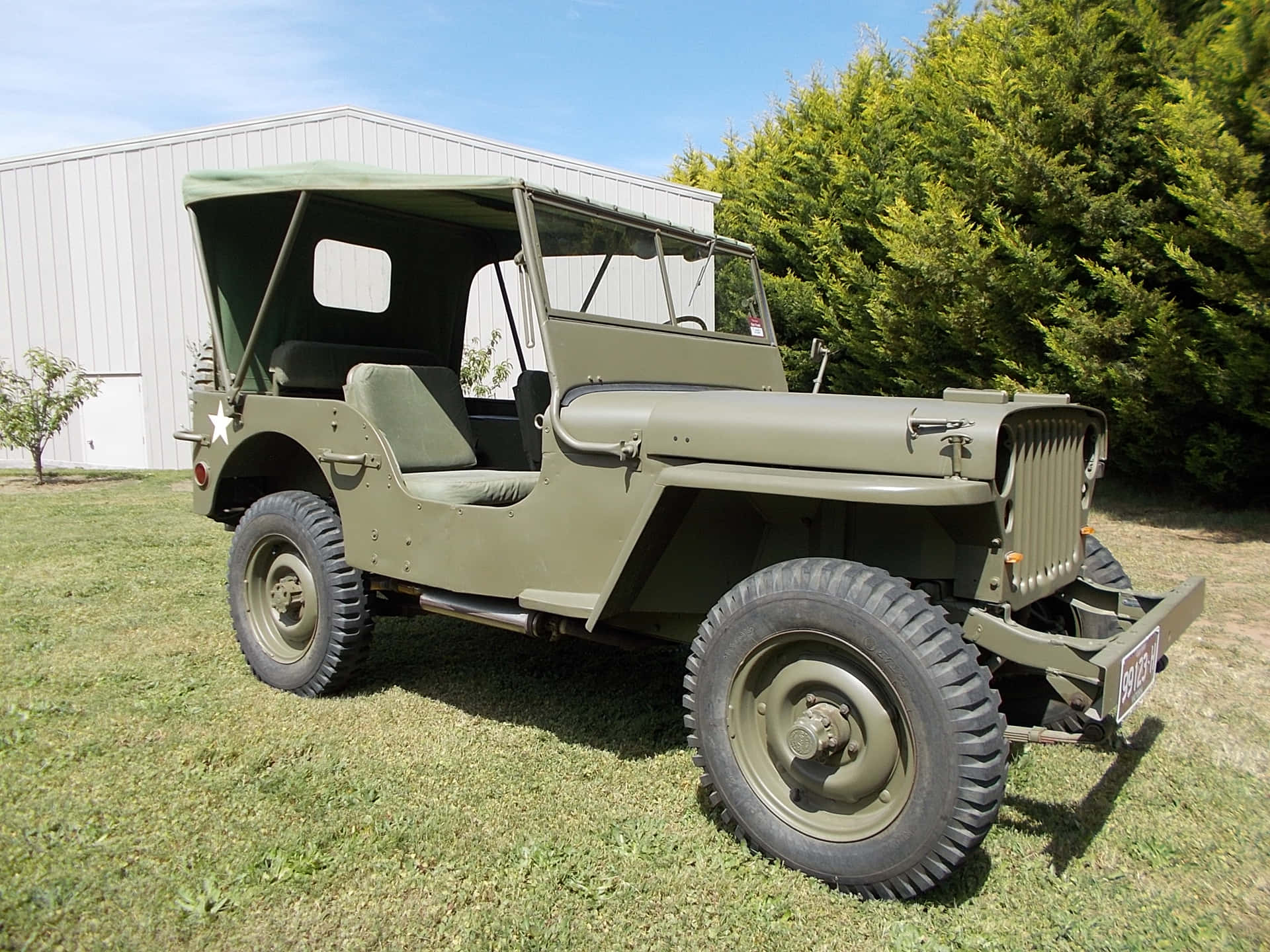 Vintage Jeep Willys - A Classic Off-Road Adventure Icon Wallpaper