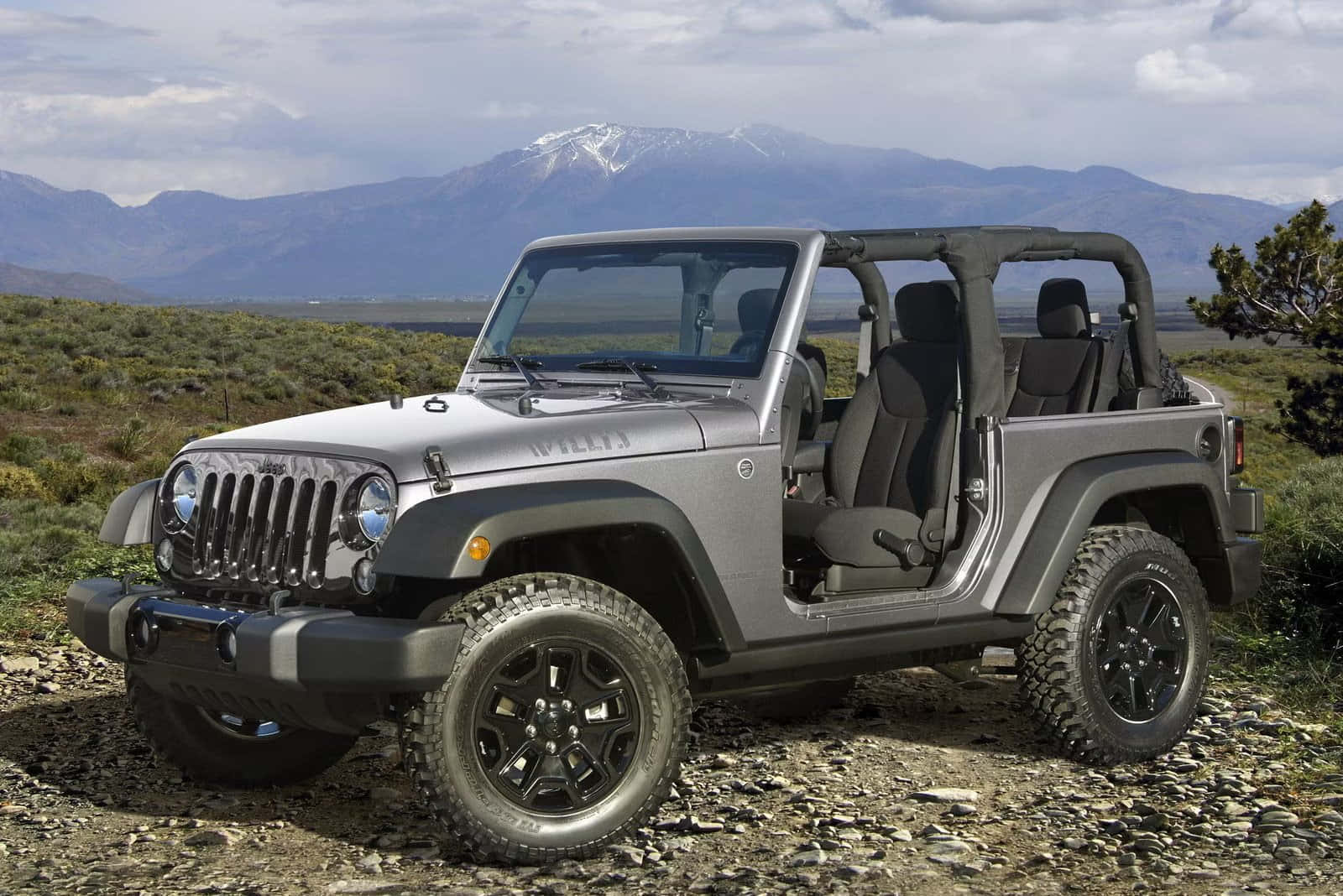The 2014 Jeep Wrangler Is Parked On A Rocky Mountain