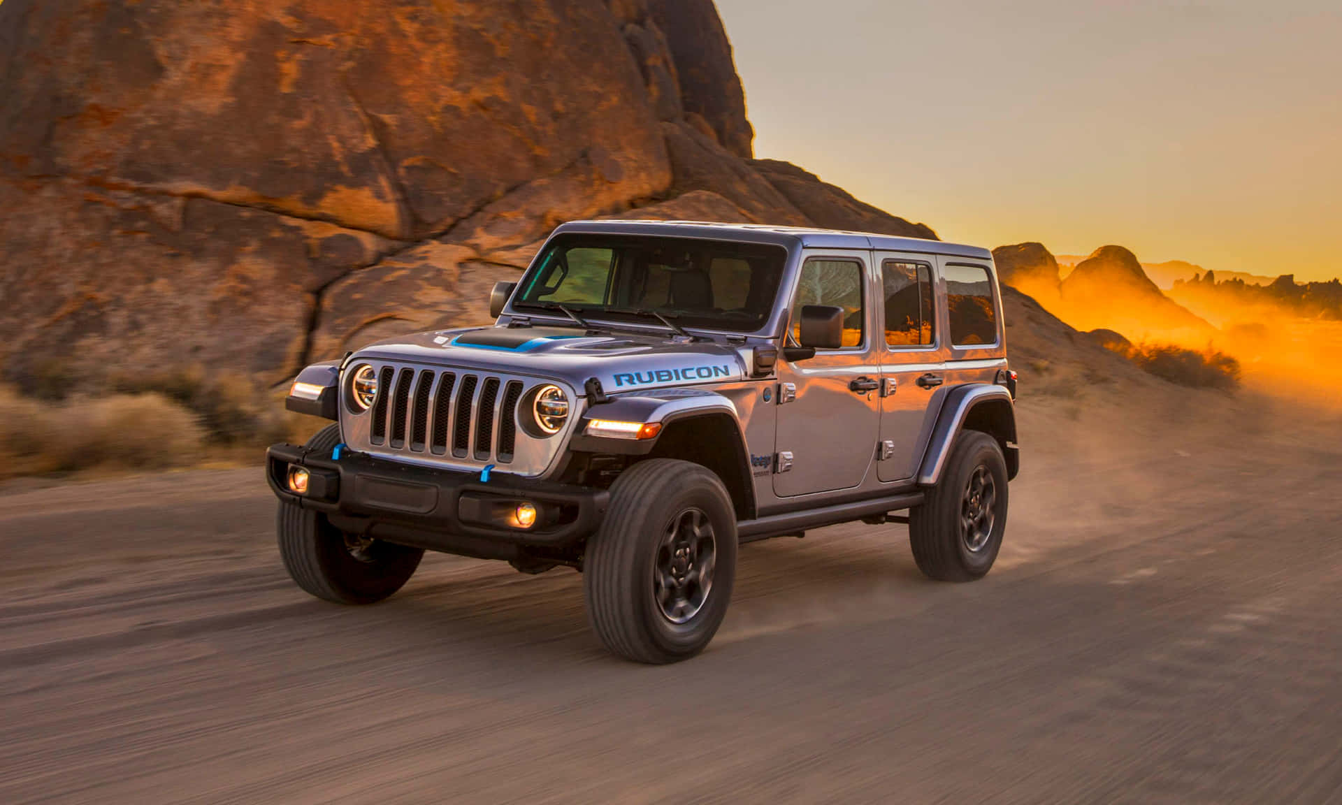 The 2020 Jeep Wrangler Is Driving Down A Dirt Road