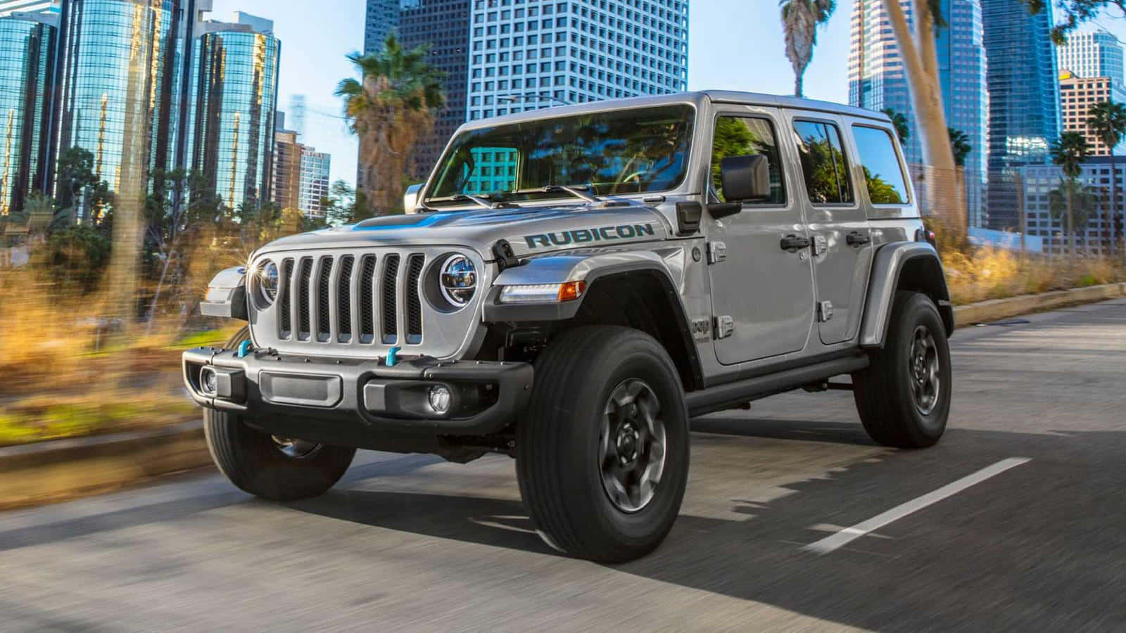 The 2020 Jeep Wrangler Is Driving Down A City Street