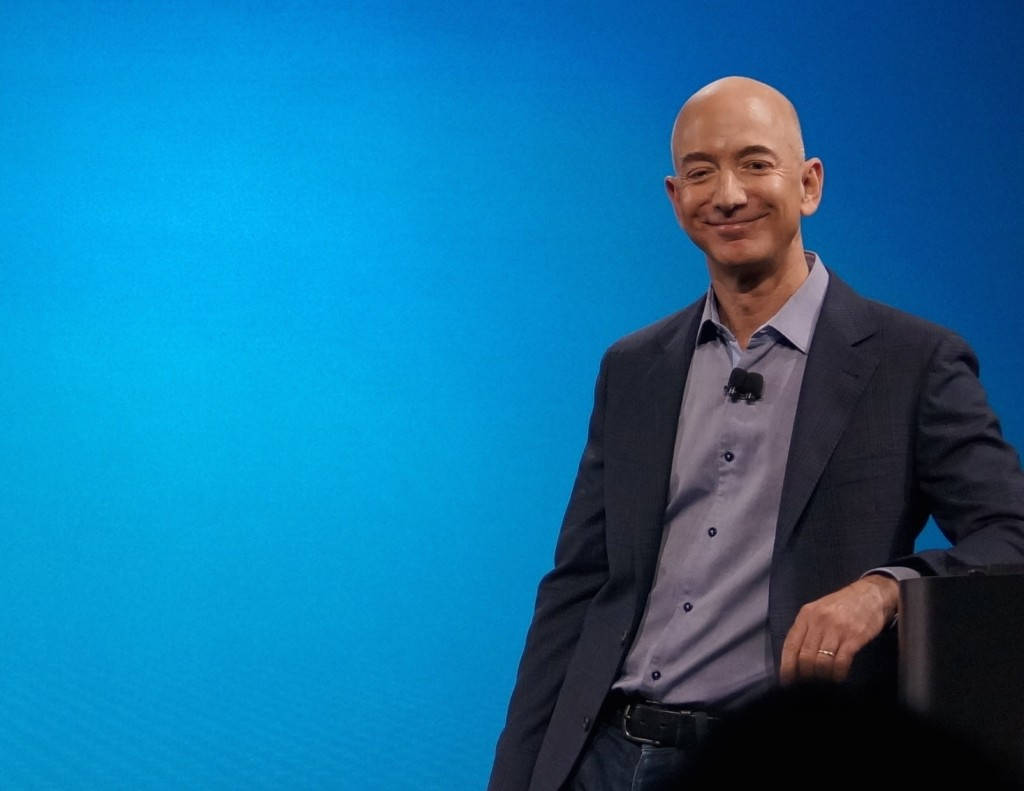 Jeff Bezos Leaning Blue Background Wallpaper