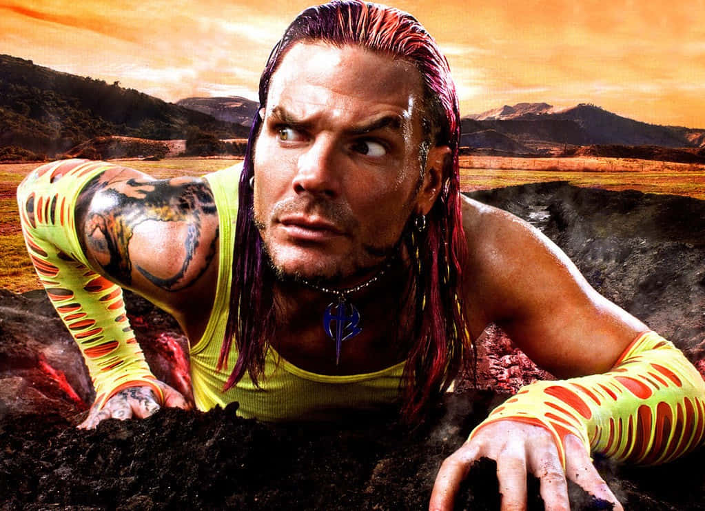 Jeff Hardy Climbing Up From Volcano Wallpaper