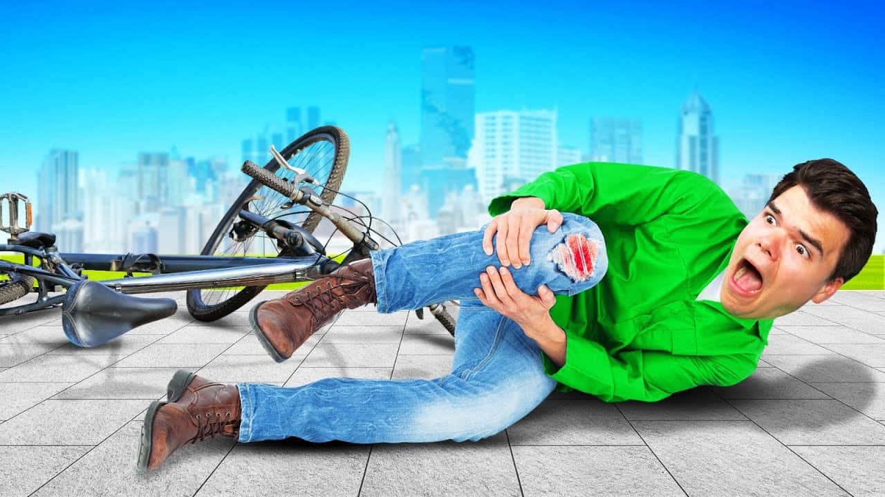 Einmann Liegt Auf Dem Boden Mit Seinem Fahrrad. Wallpaper