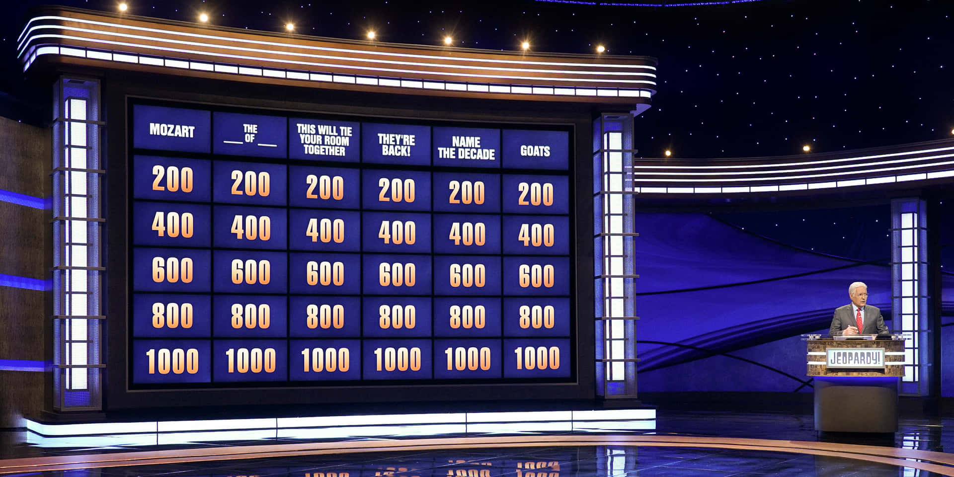 A Man Standing In Front Of A Jeopardy Board