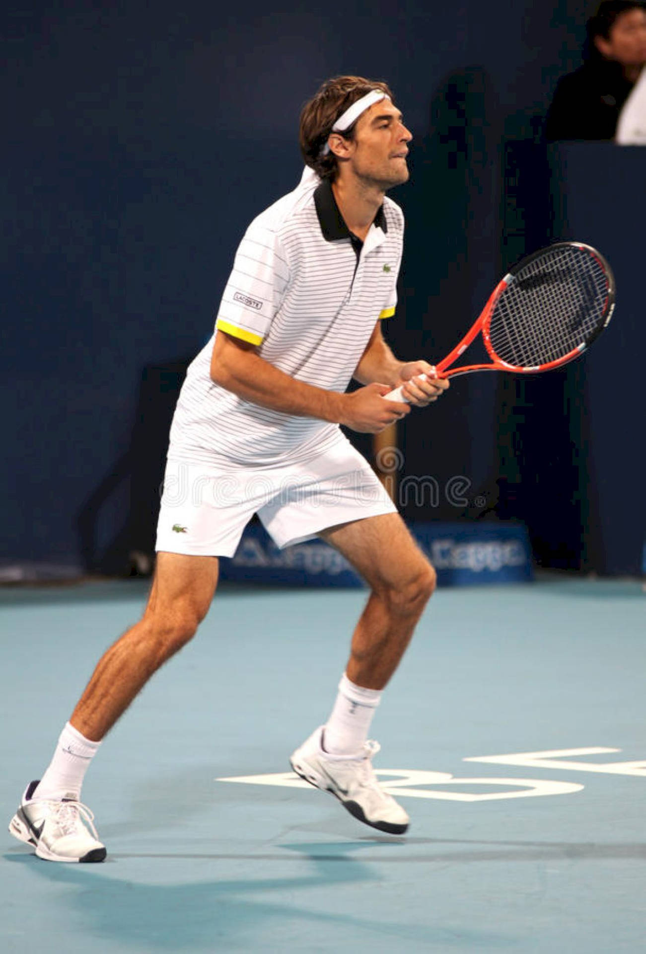 Jeremy Chardy playing a powerful forehand in a professional tennis match Wallpaper
