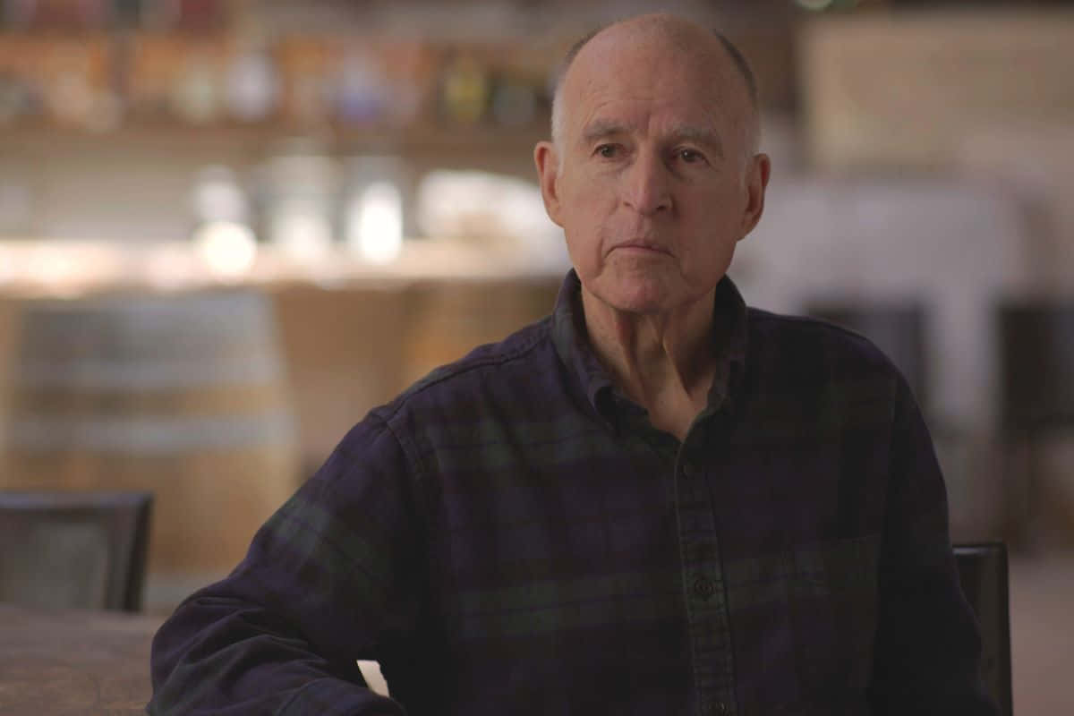 Jerry Brown Sitting in a Chair Wallpaper
