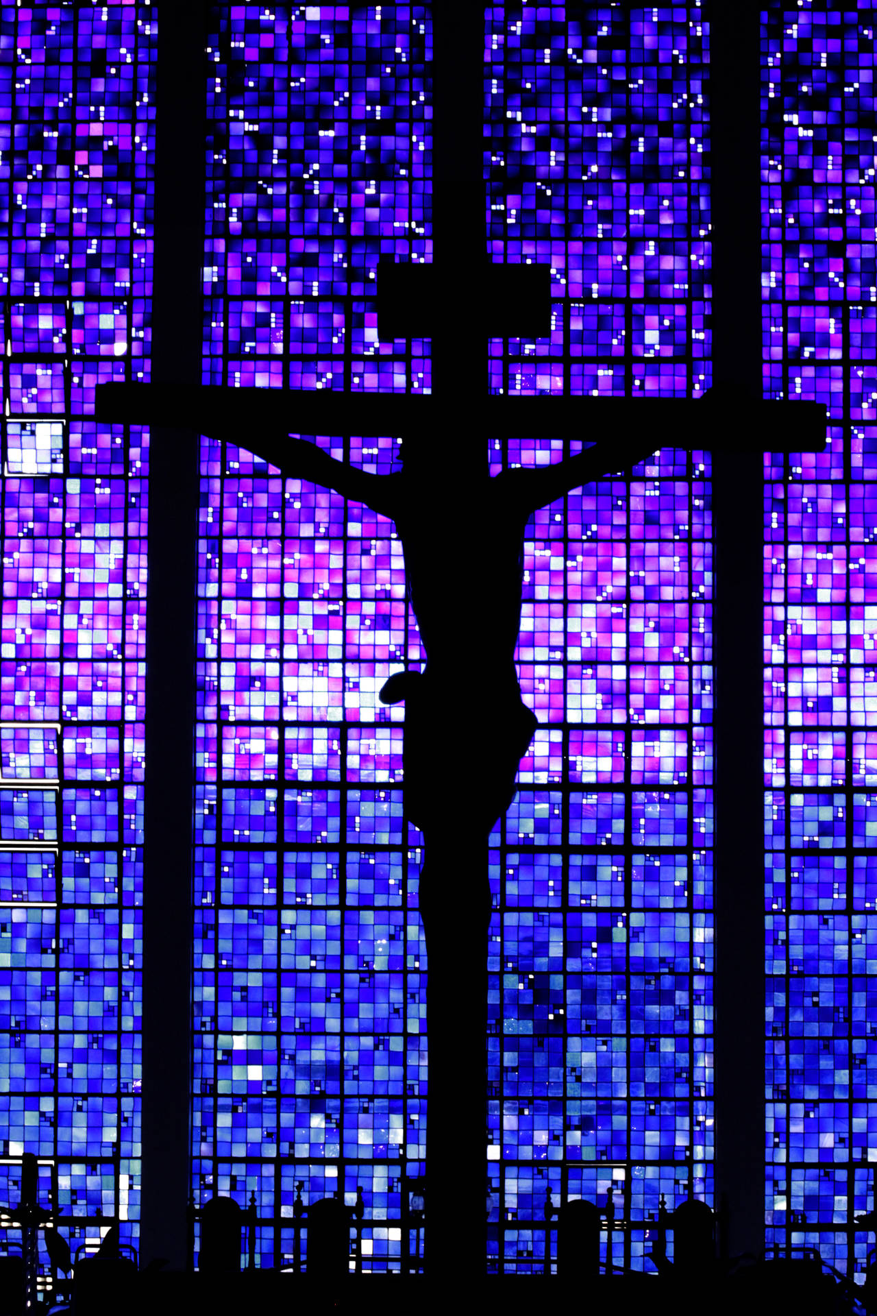 Jesus On Cross Silhouette Against Purple Window Wallpaper